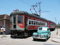 Re-built Brill cars (1920) are passing through the town of Caraballo